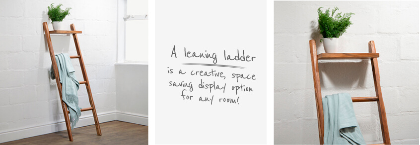 Teak decorative leaning ladder with duck egg coloured throw